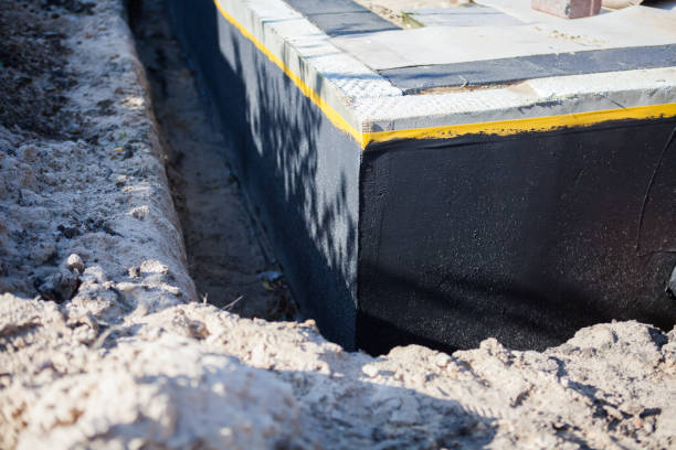 Professional Waterproofing technician working in Rosewood, OH